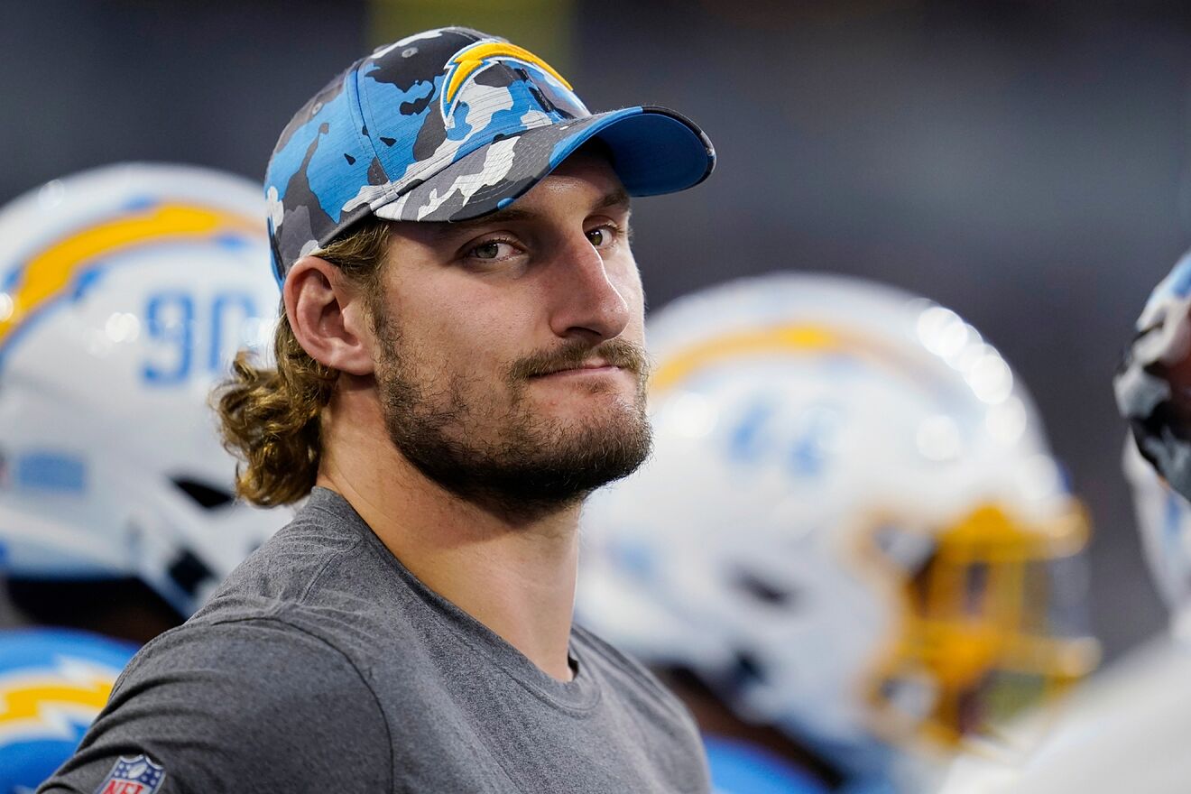 Joey Bosa watches from the sideline during the first half of a Los...