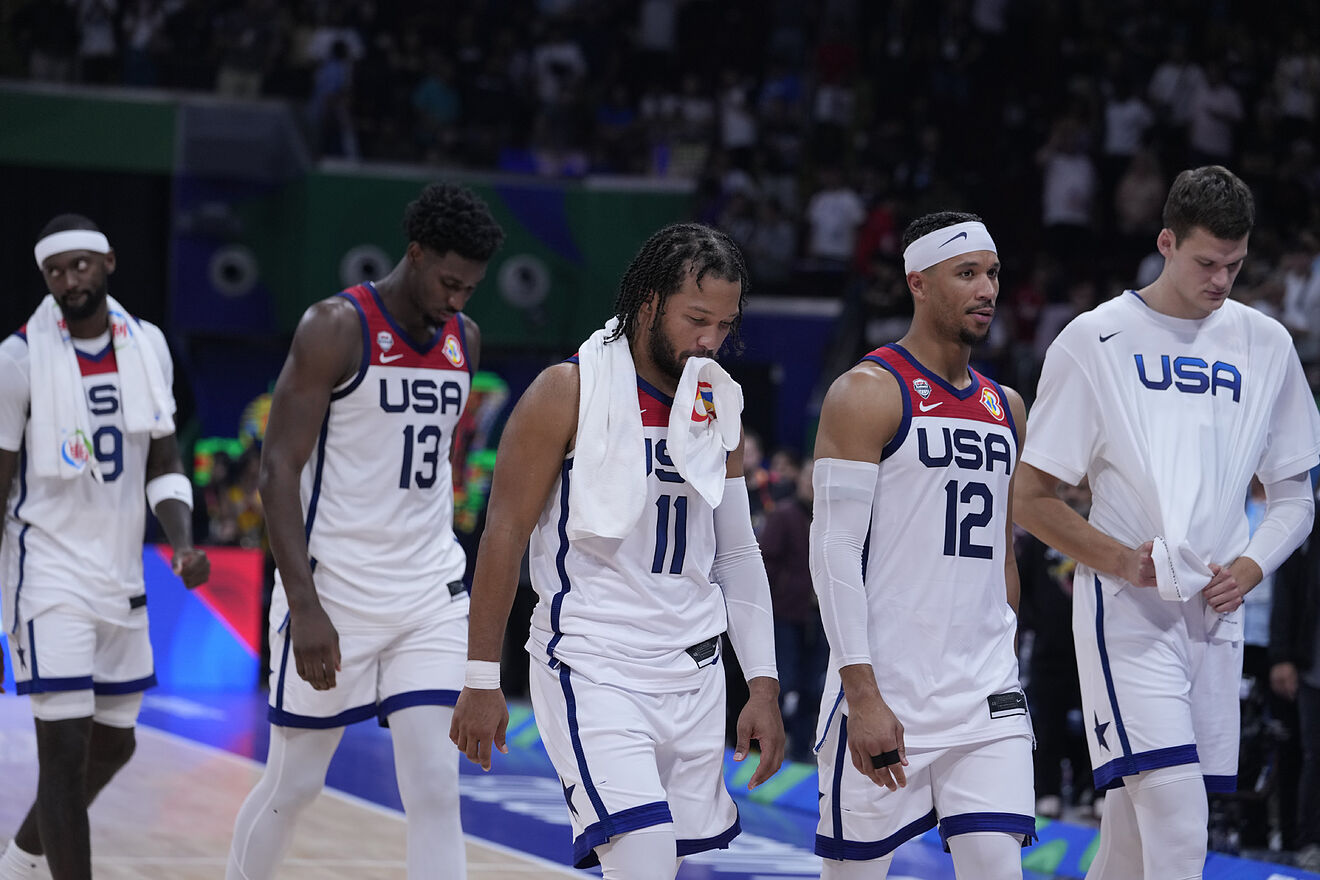 Players form the United States walk off the court ofter their loss to...