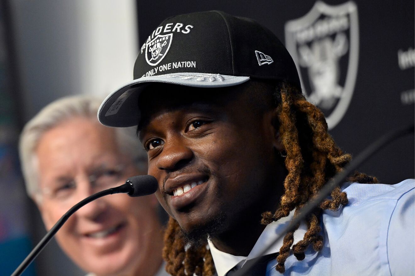 Ashton Jeanty with Pete Carroll during the running back's introduction...