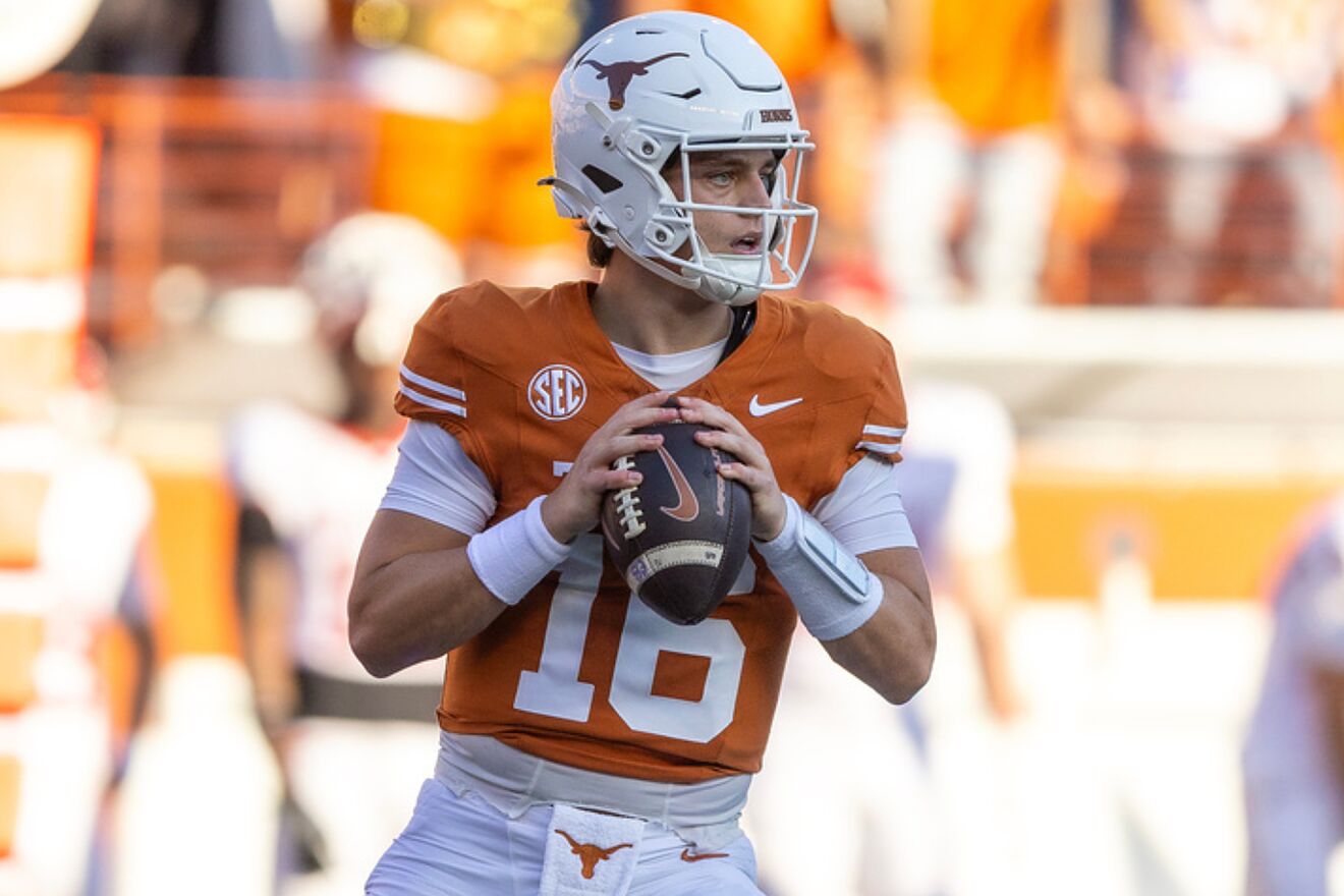 Arch Manning drops back to pass during a Texas Longhorns game during...