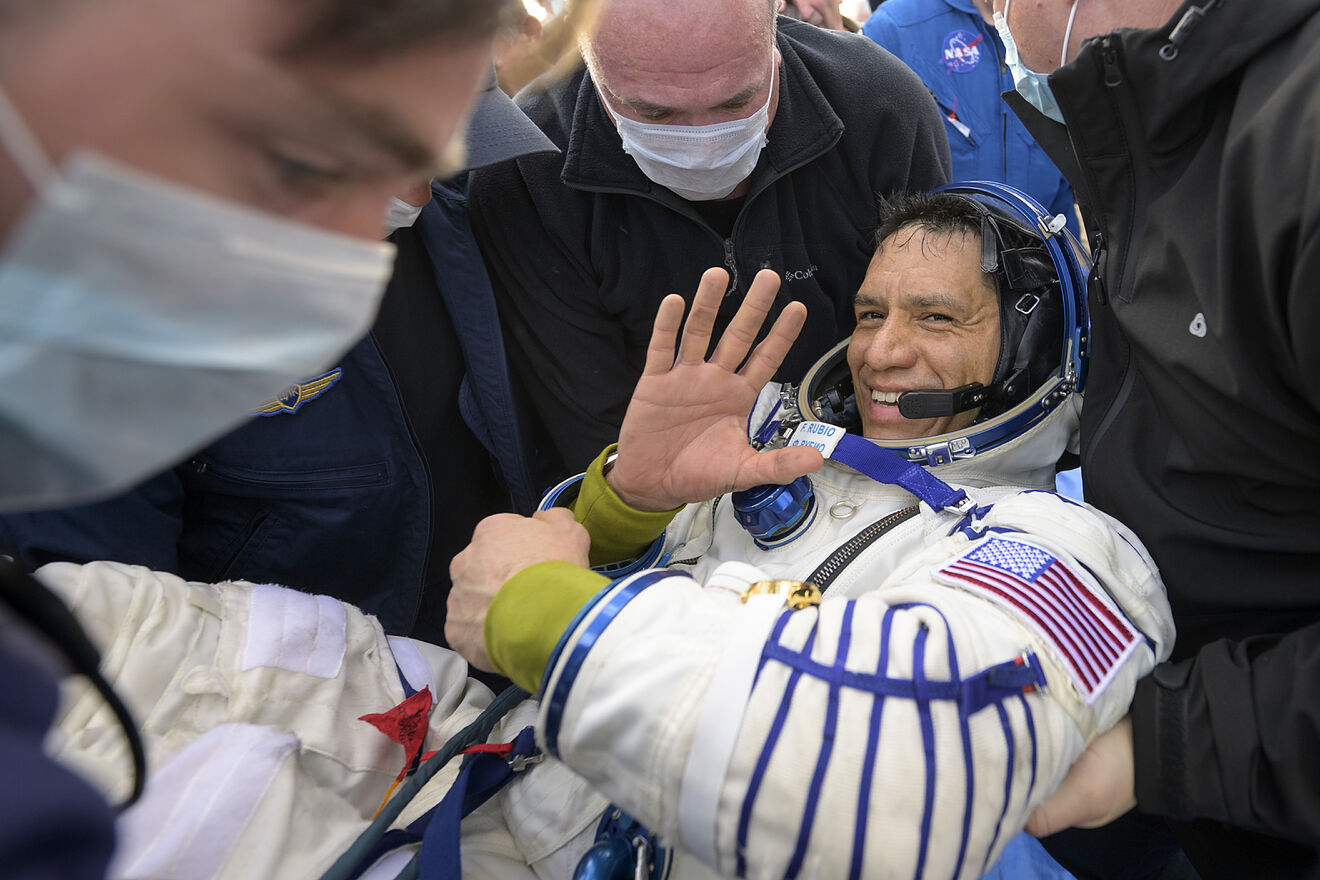 NASA astronaut Frank Rubio is helped out of the Soyuz MS-23 spacecraft...