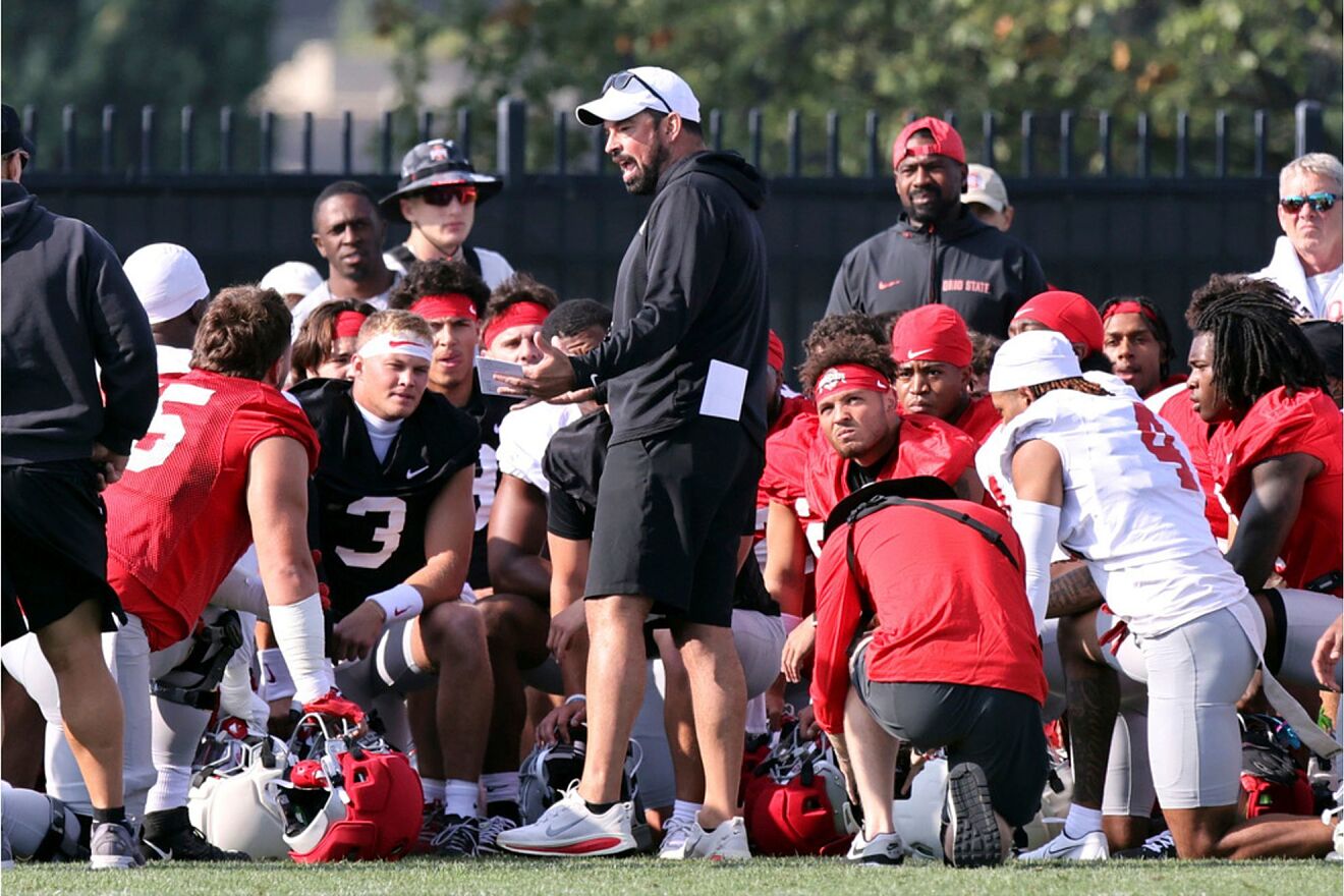 Ohio State coach Ryan Day talks to his team during NCAA college...