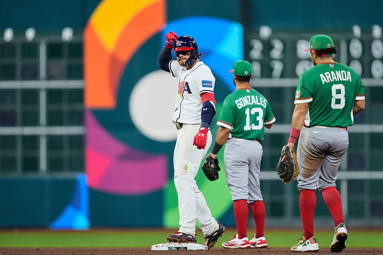 United States' Bobby Witt Jr., left, reacts after hitting a double...