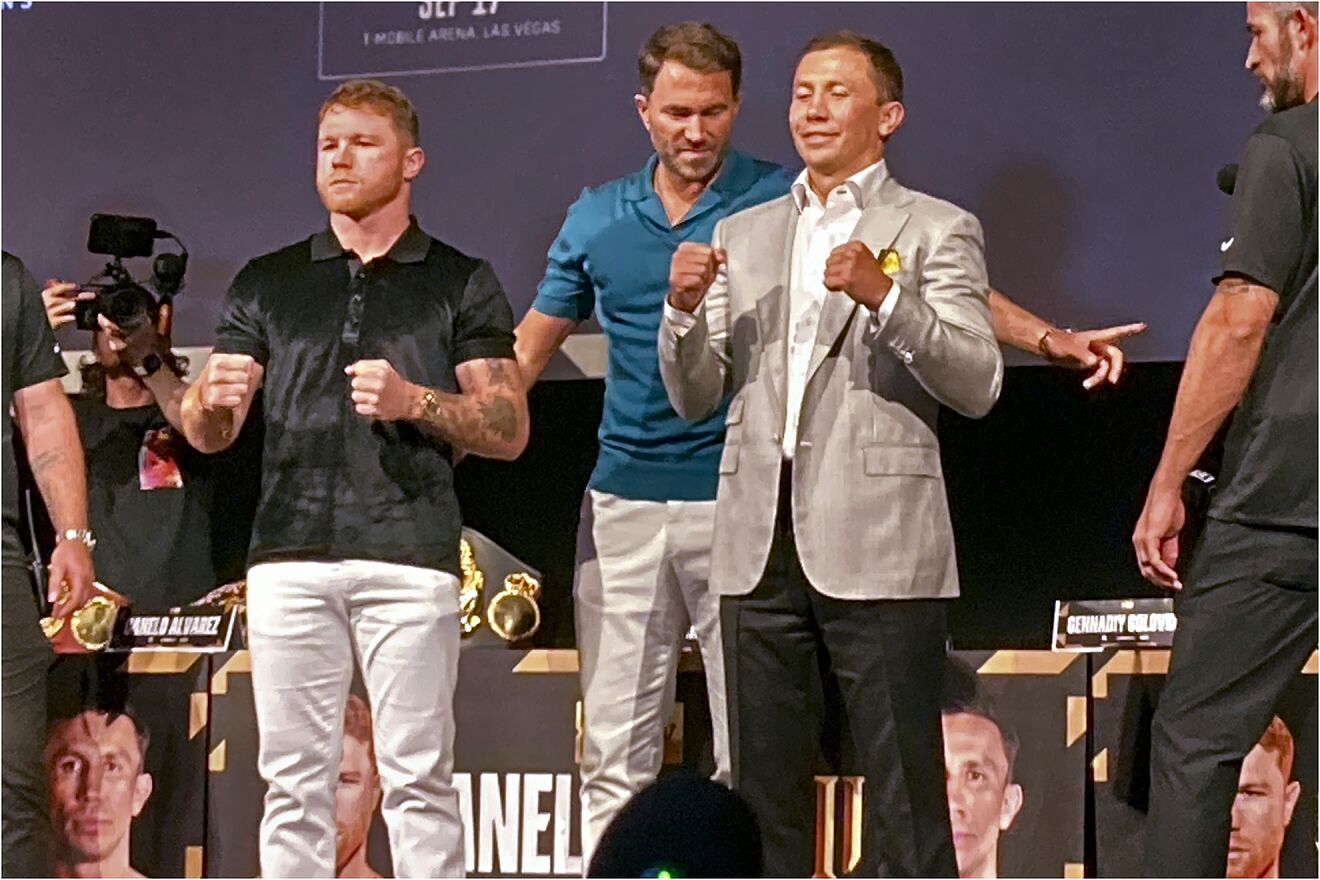 Saul "Canelo" Alvarez, left, poses with Gennadiy Gennadyevich...