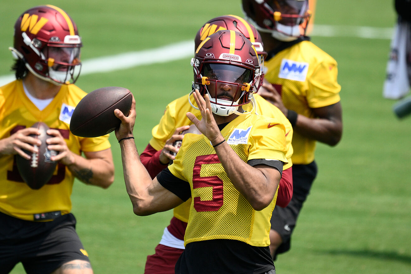 Washington Commanders quarterback Jayden Daniels (5) works out during...