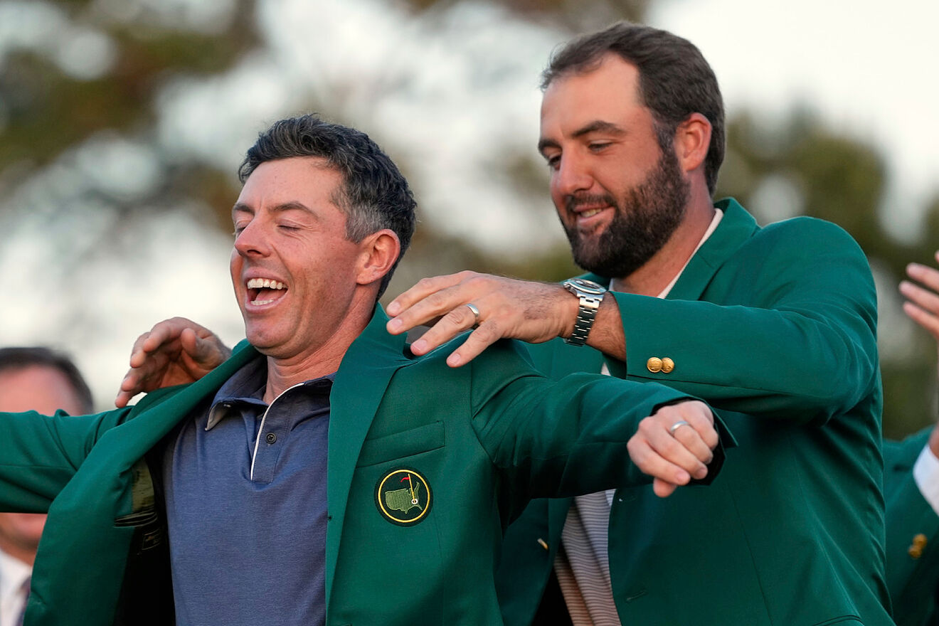 Scottie Scheffler graces Rory McIlroy with the green jacket after the...