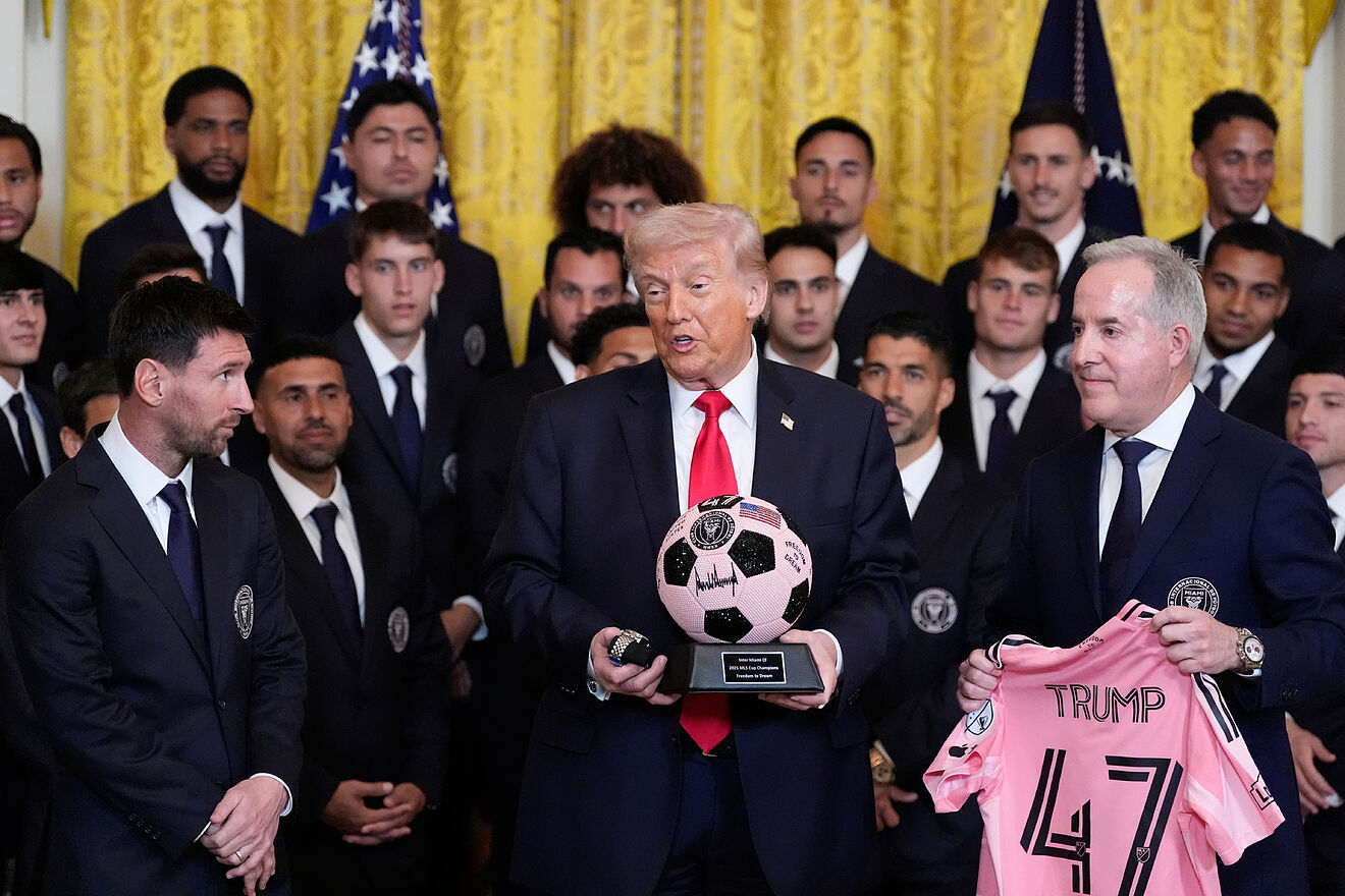 Trump holds a signed soccer ball and Tudor Black Bay watch as Inter...