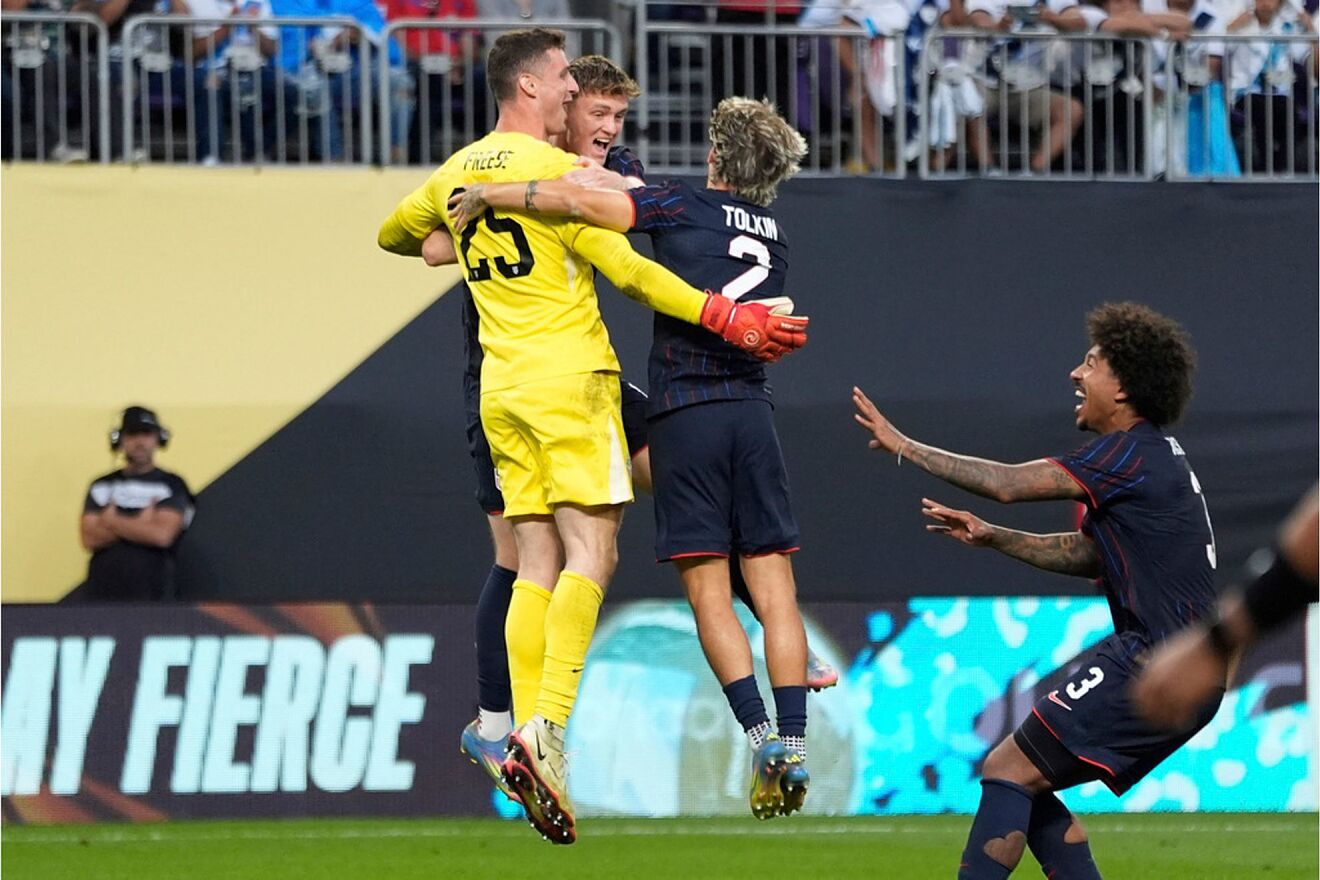United States goalkeeper Matthew Freese celebrates with teammates...