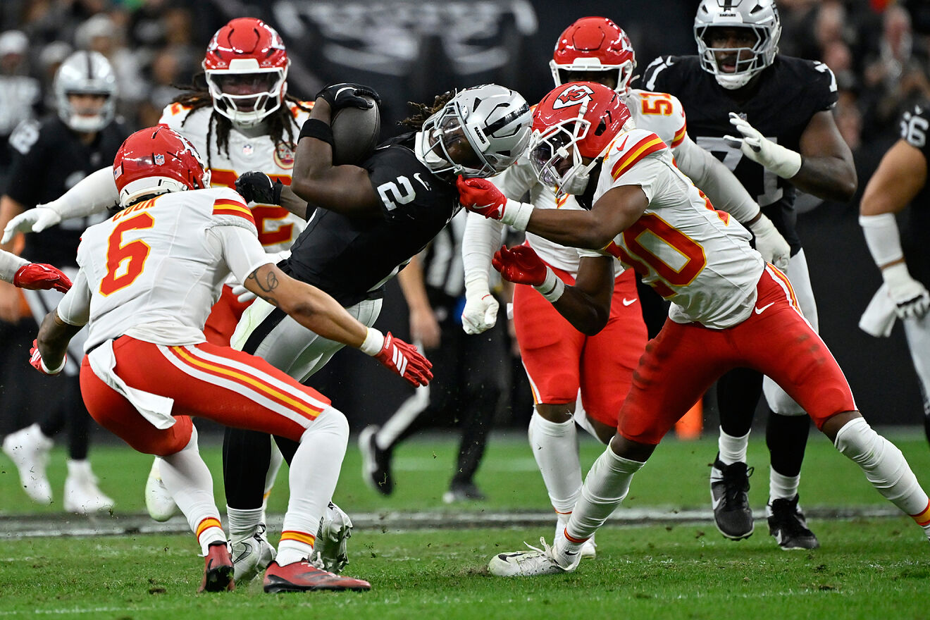 Las Vegas Raiders running back Ashton Jeanty struggles for yardage...