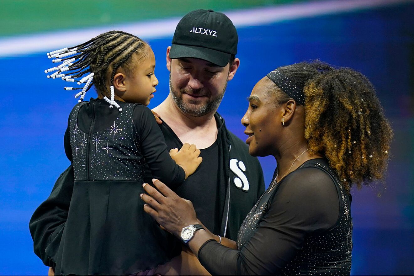 Serena Williams, of the United States, talks with her daughter Olympia...