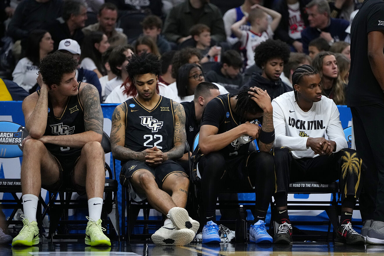UCF players react on the bench on the final minute against UCLA in the...