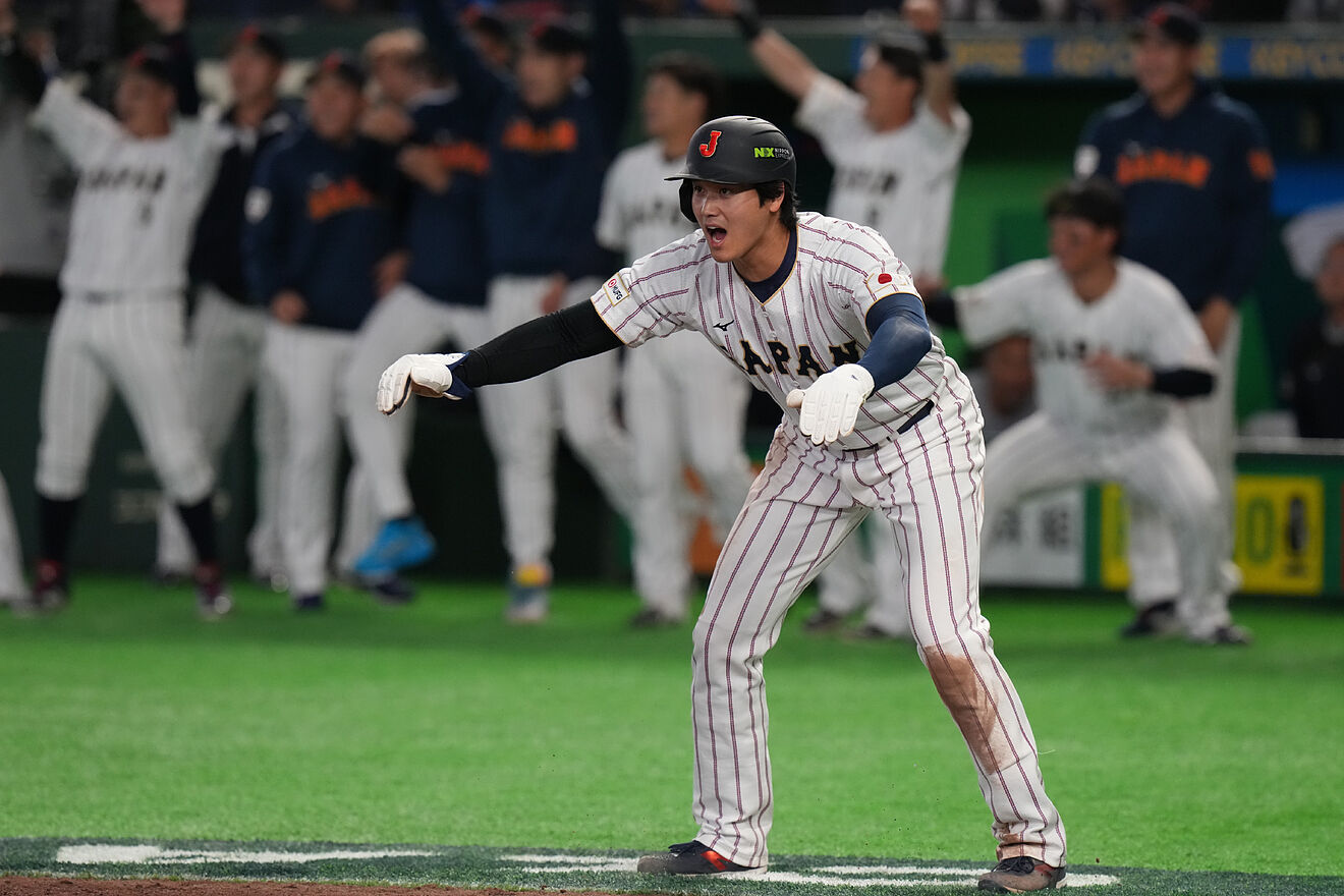 Shohei Ohtani reacts during the seventh inning of a World Baseball...