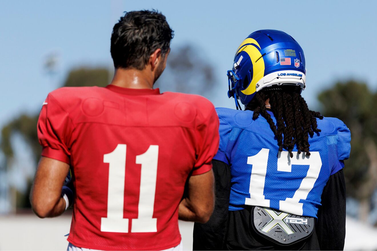 Los Angeles Rams quarterback Jimmy Garoppolo (11) and wide receiver...