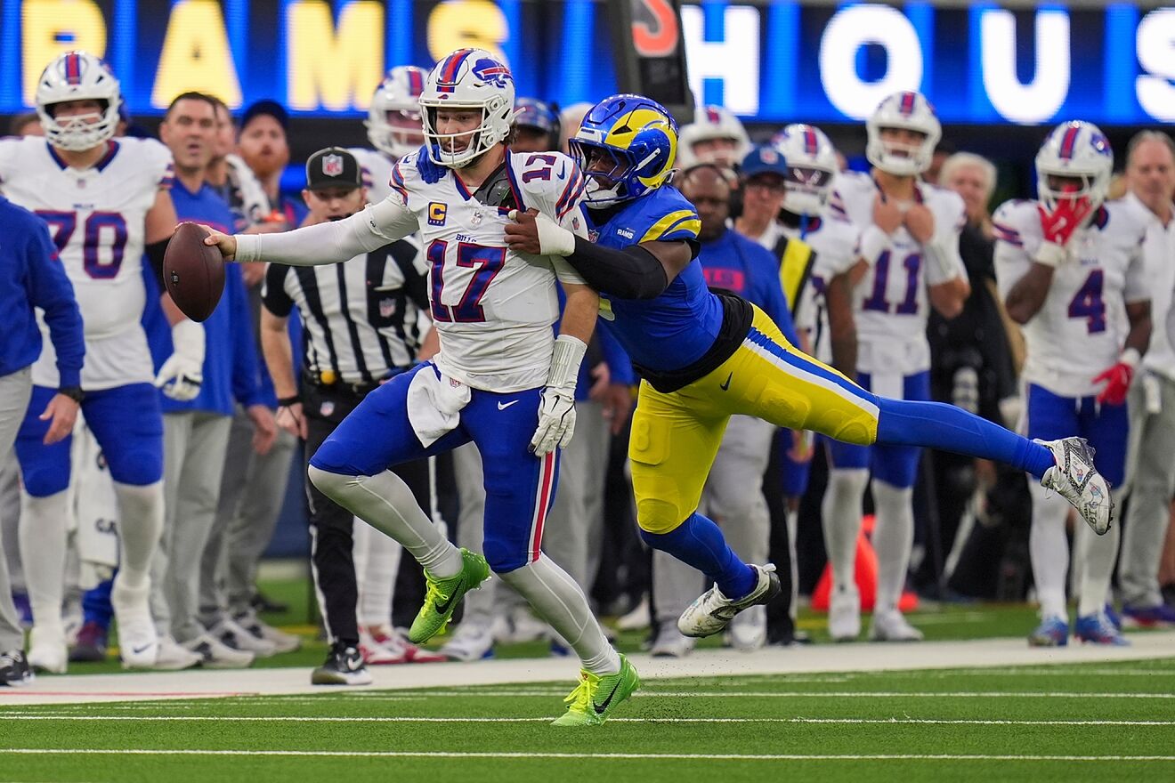 Buffalo Bills quarterback Josh Allen (17) is hit by Los Angeles Rams...