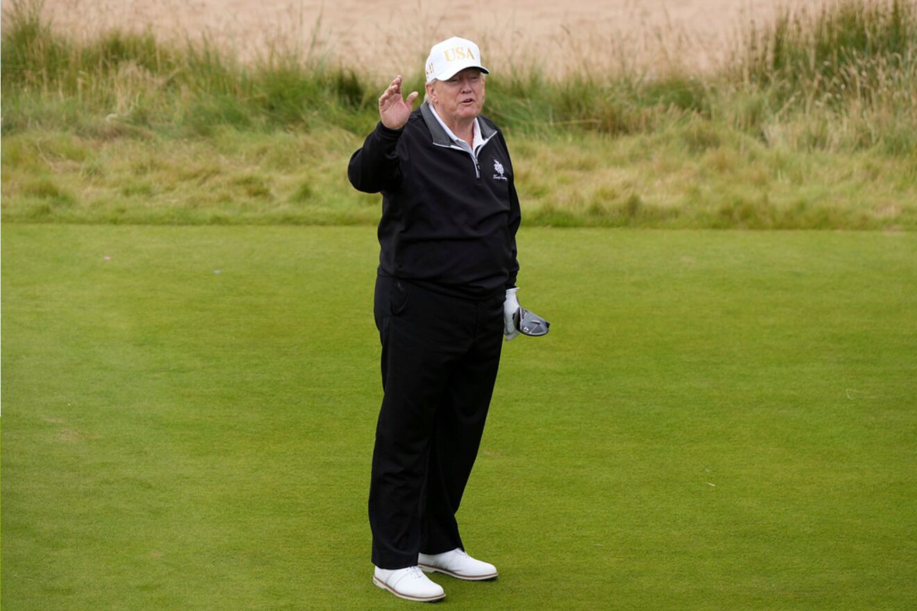 President Donald Trump gestures as he starts playing golf after the...
