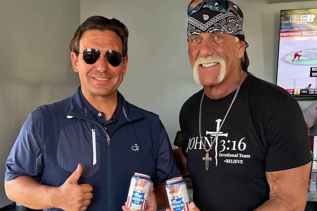 Hulk Hogan (r) holds a can of his Real American Beer with Florida...