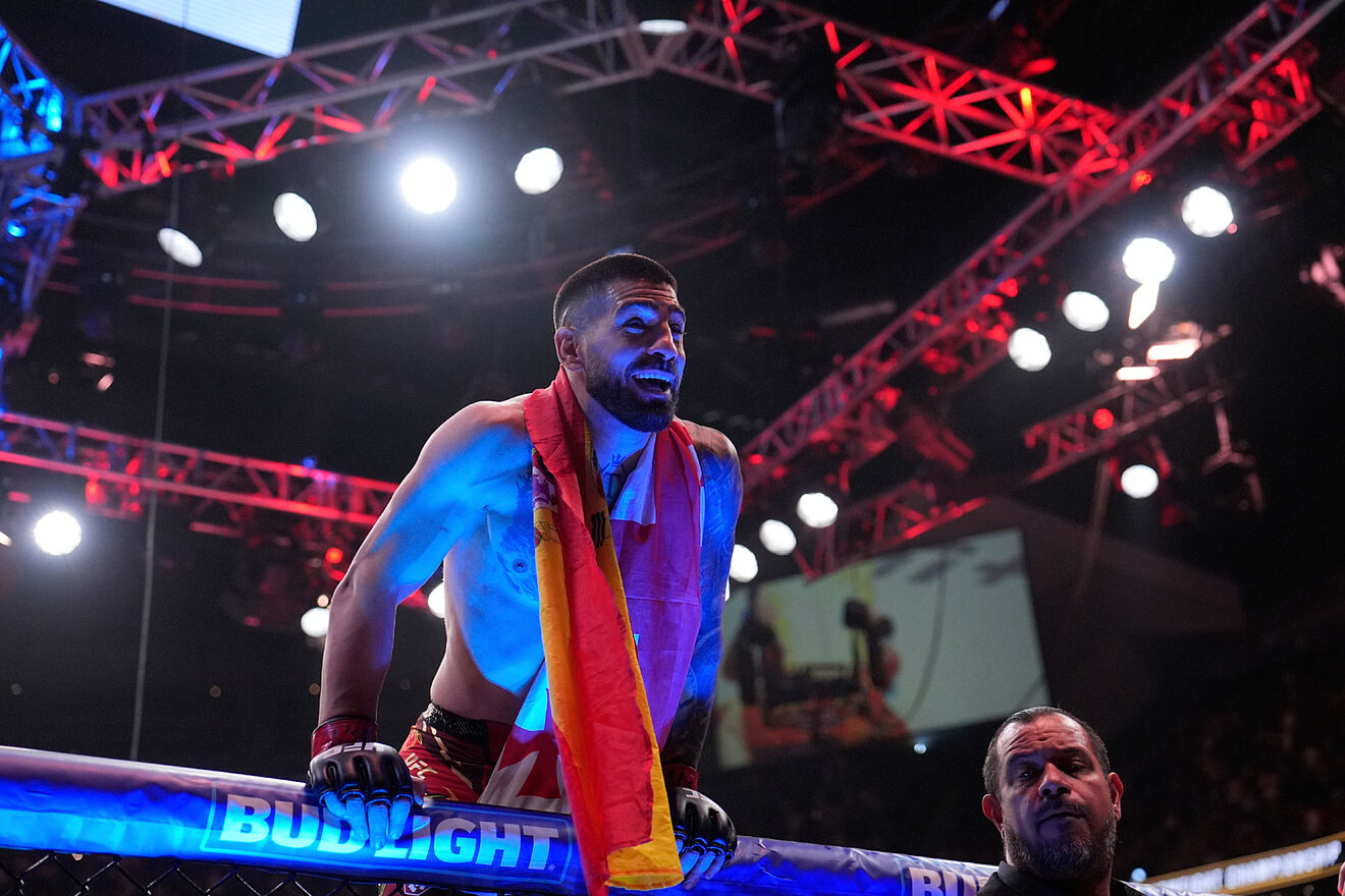 Ilia Topuria celebrates after defeating Charles Oliveira in a...