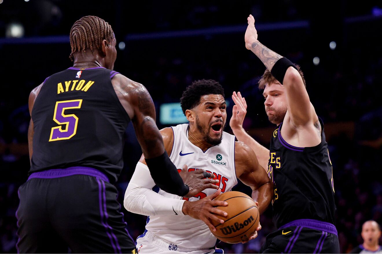 Detroit Pistons forward Tobias Harris, center, drives to the basket as...