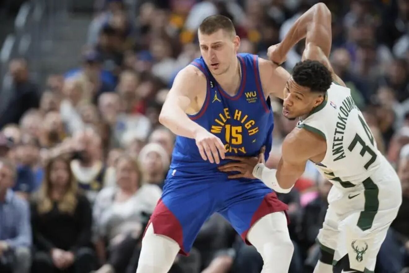 Nikola Jokic facing Giannis Antetokounmpo in an NBA game.
