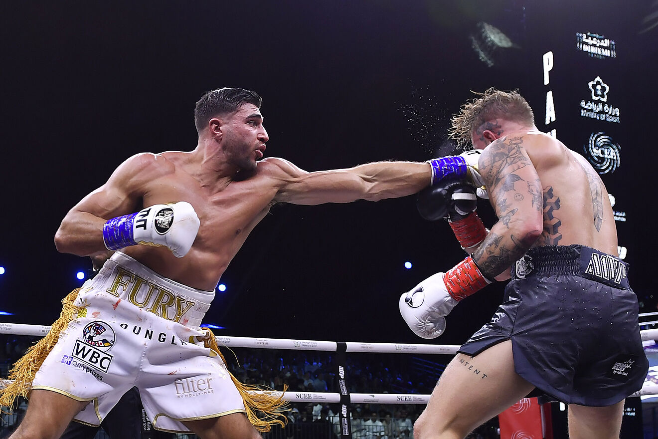 Jake Paul, right, and Tommy Fury, in action