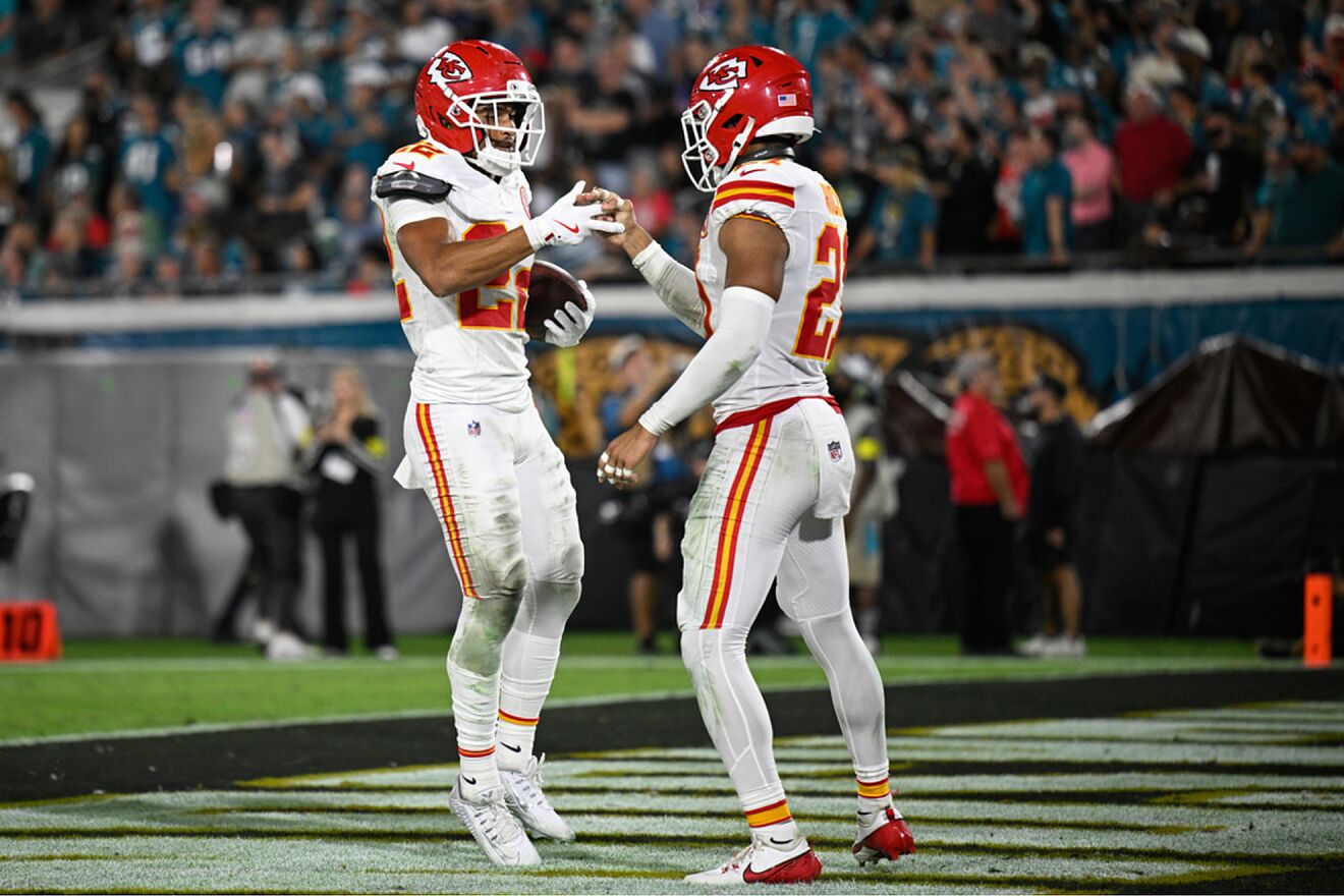Kansas City Chiefs cornerback Trent McDuffie, left, celebrates with...