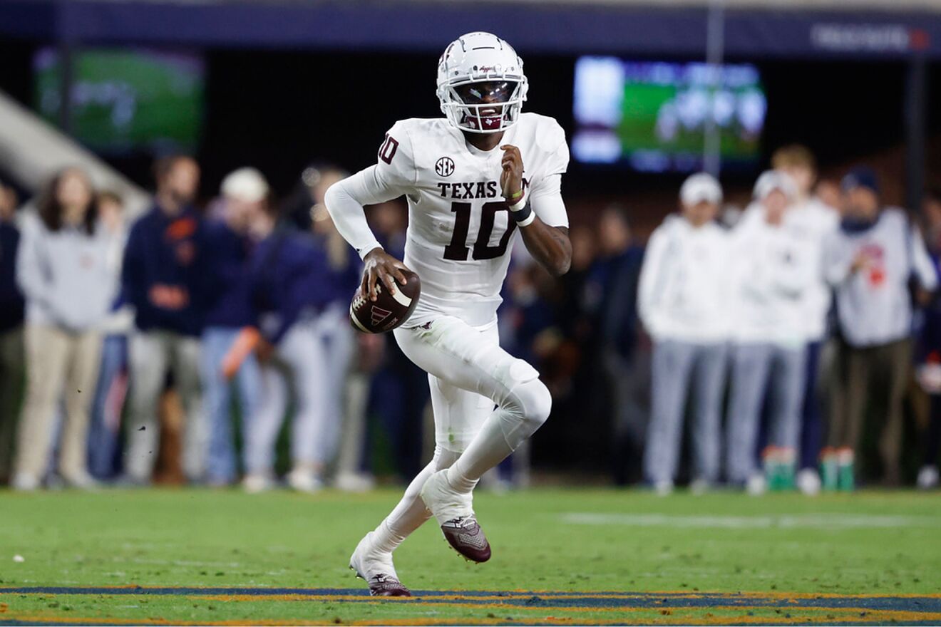 Texas A&M quarterback Marcel Reed carries the ball against Auburn...