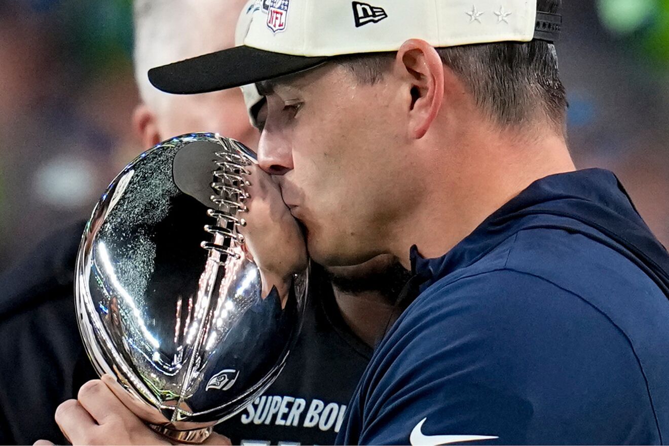 Seattle Seahawks head coach Mike Macdonald kisses the Lombardi Troph