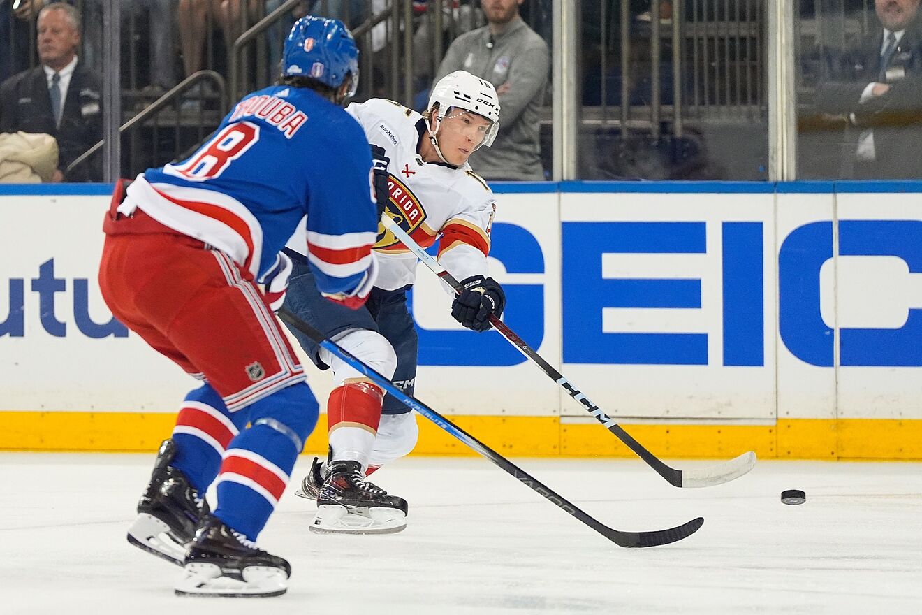 Florida Panthers center Anton Lundell (15) passes the puck against New...