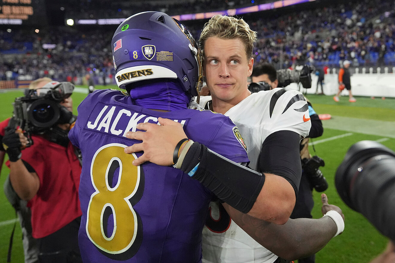 Cincinnati Bengals quarterback Joe Burrow, right, and Baltimore Ravens...