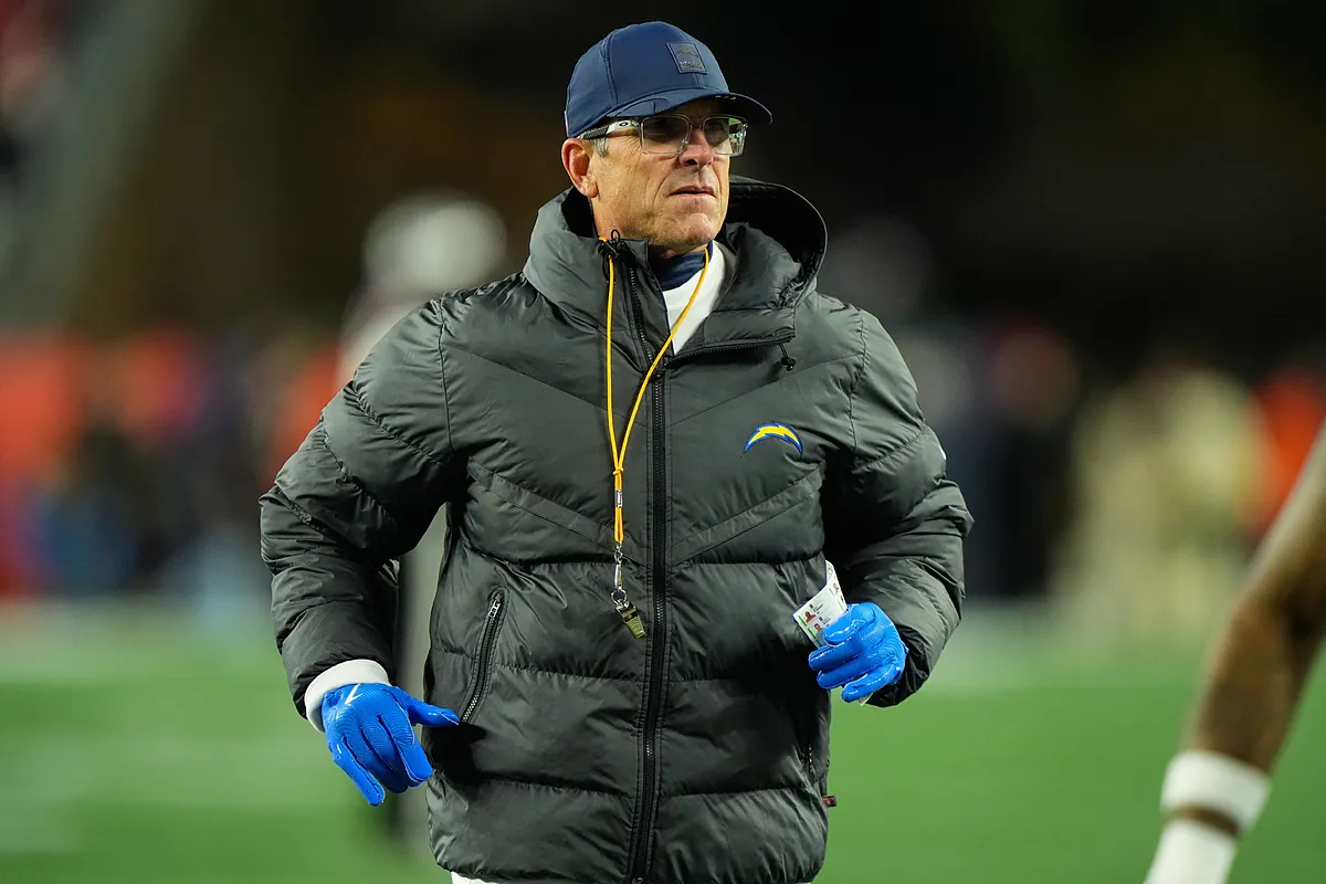 Jim Harbaugh chooses the stands over luxury suites at the NFL Combine