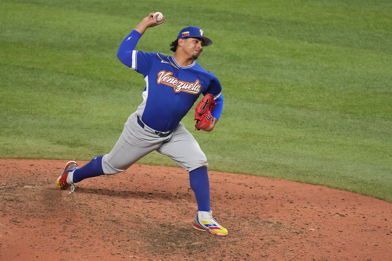 Venezuela pitcher Daniel Palencia aims a pitch during the ninth inning...