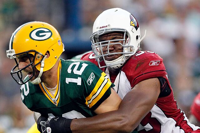 Arizona Cardinals' Calais Campbell sacks Green Bay Packers' Aaron Rodgers (12) during the first half of an NFL preseason football game