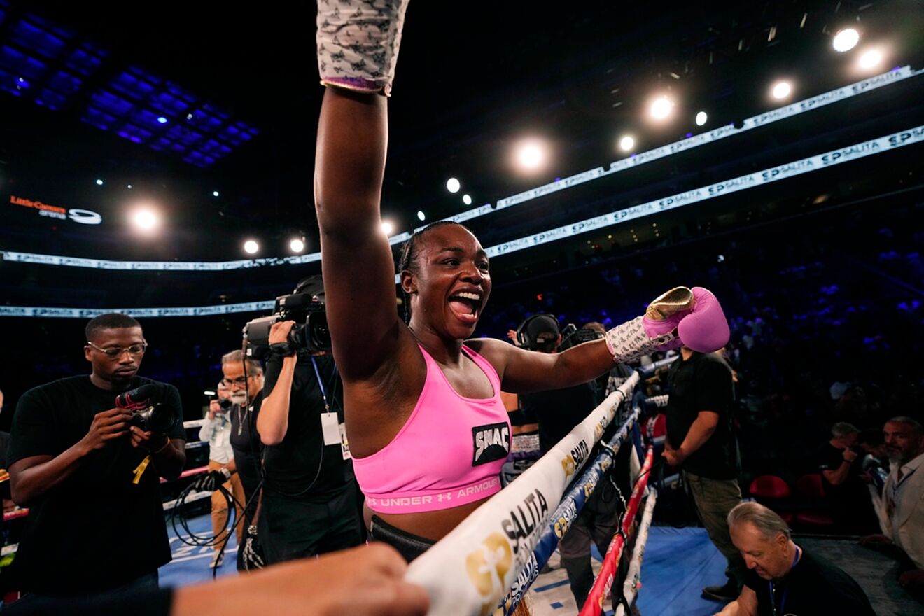 Middleweight champion Shields celebrates after defeating reigning WBC...
