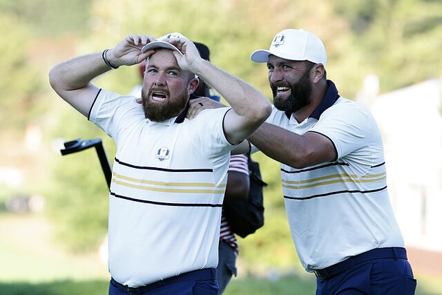 Lowry y Rahm tras ganar el primero su partido.