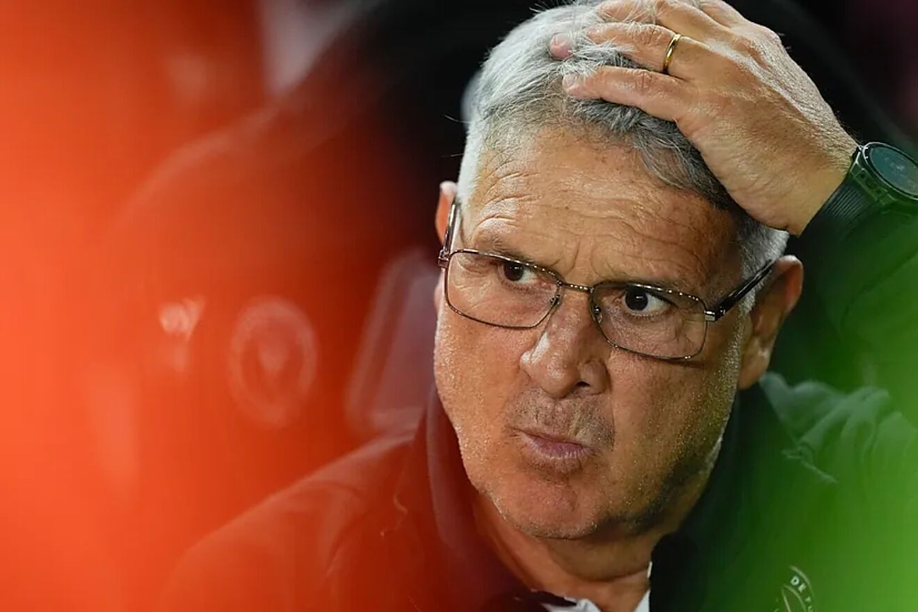 Martino takes his hand to his head in a match