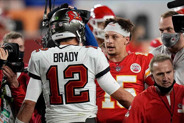 Tampa Bay Buccaneers quarterback Tom Brady, speaks with Kansas City Chiefs quarterback Patrick Mahomes after Super Bowl 55