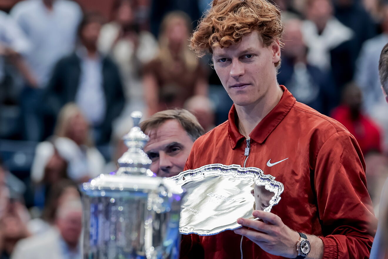 Jannik Sinner off Italy lifts the runner up trophy after losing the...