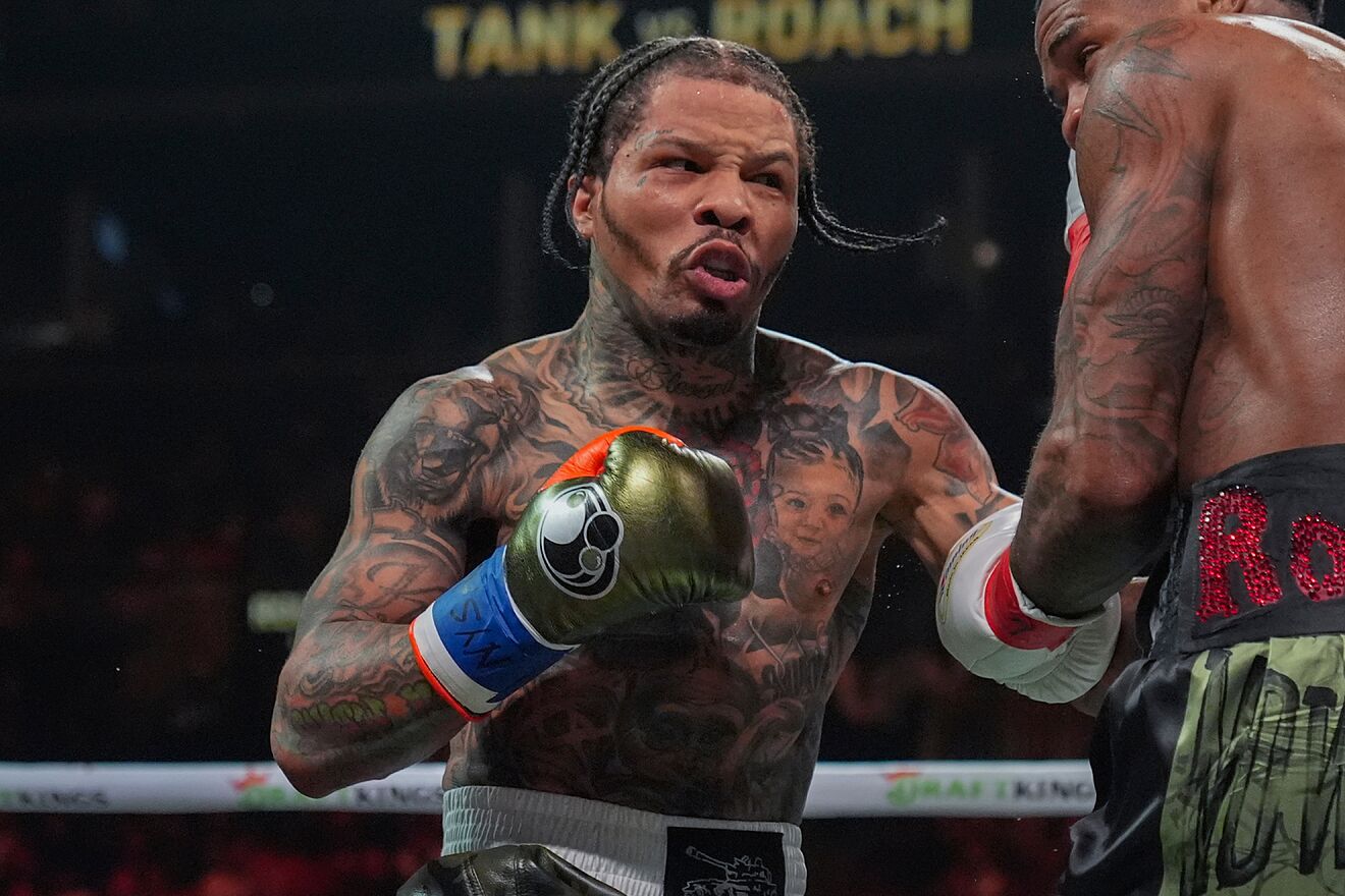 Gervonta Davis throws a punch at Lamont Roach Jr.