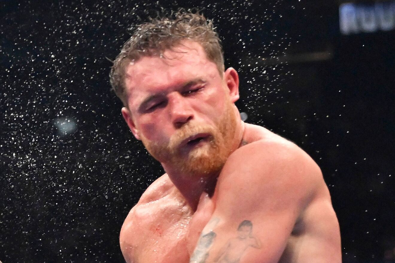 Terence Crawford, left, punches Canelo Alvarez during an undisputed...