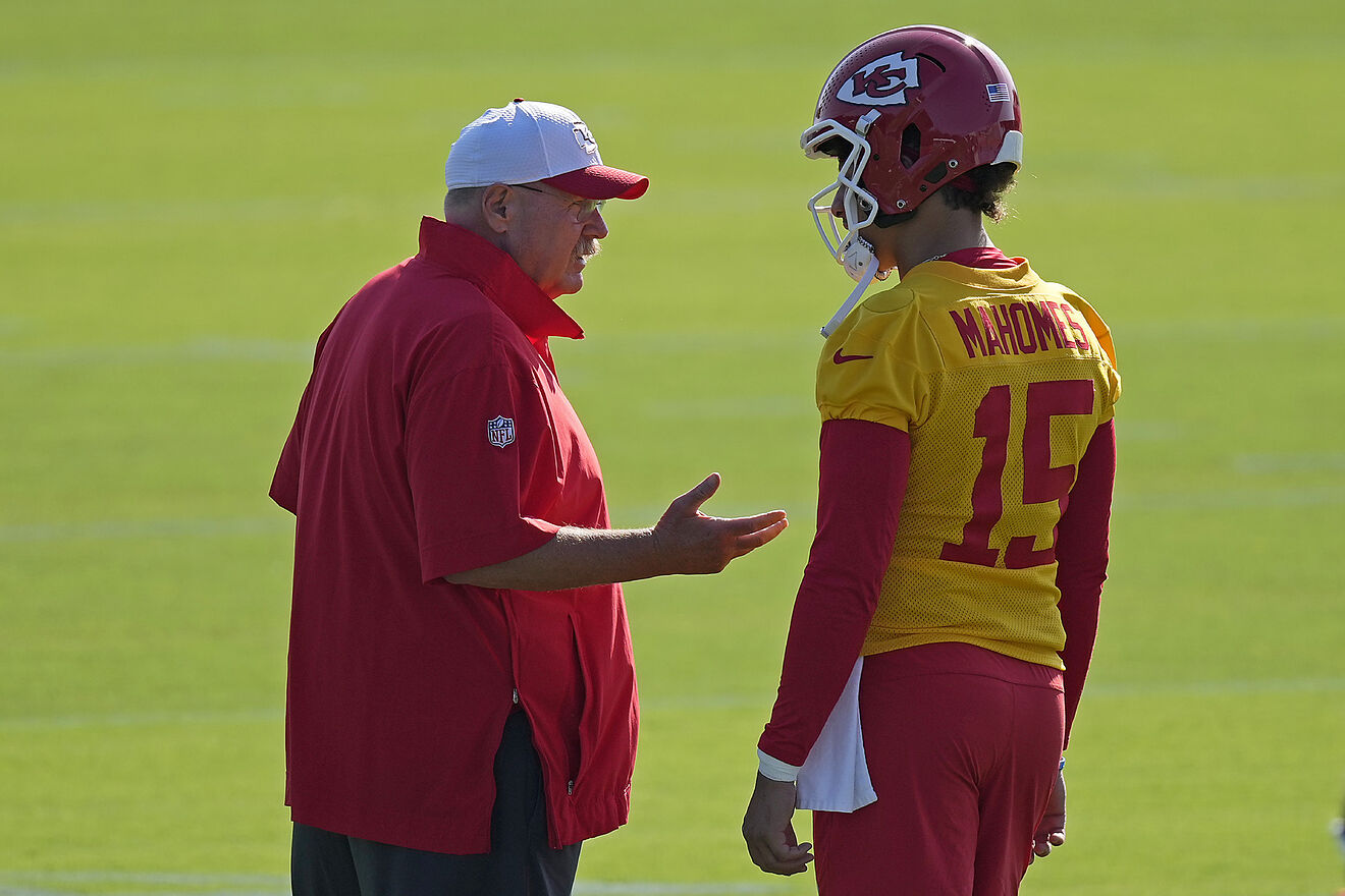 Kansas City Chiefs head coach Andy Reid talks to quarterback Patrick...