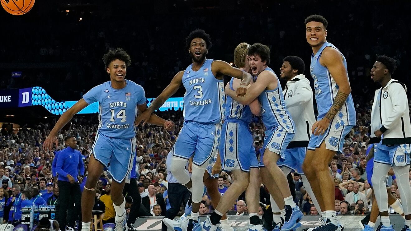 North Carolina players celebrate their victory against Duke after a...