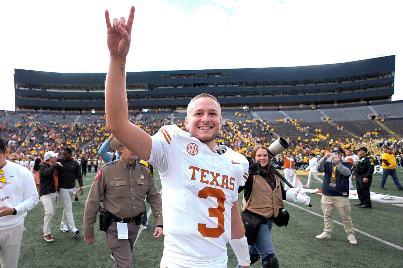 Texas quarterback Quinn Ewers smiles while acknowledging the crowd...