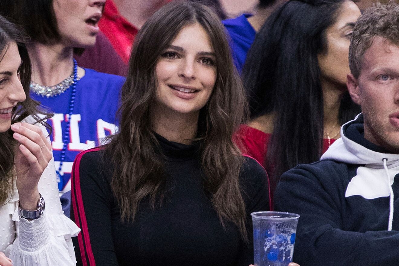 Actress Emily Ratajkowski watches an NBA basketball game between the...