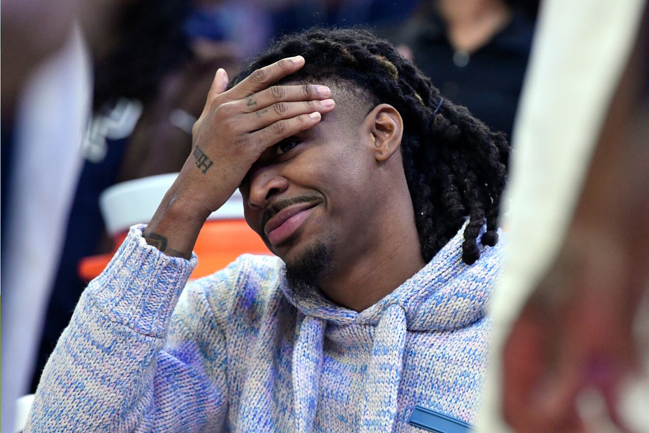 Memphis Grizzlies guard Ja Morant looks on from the bench in the...