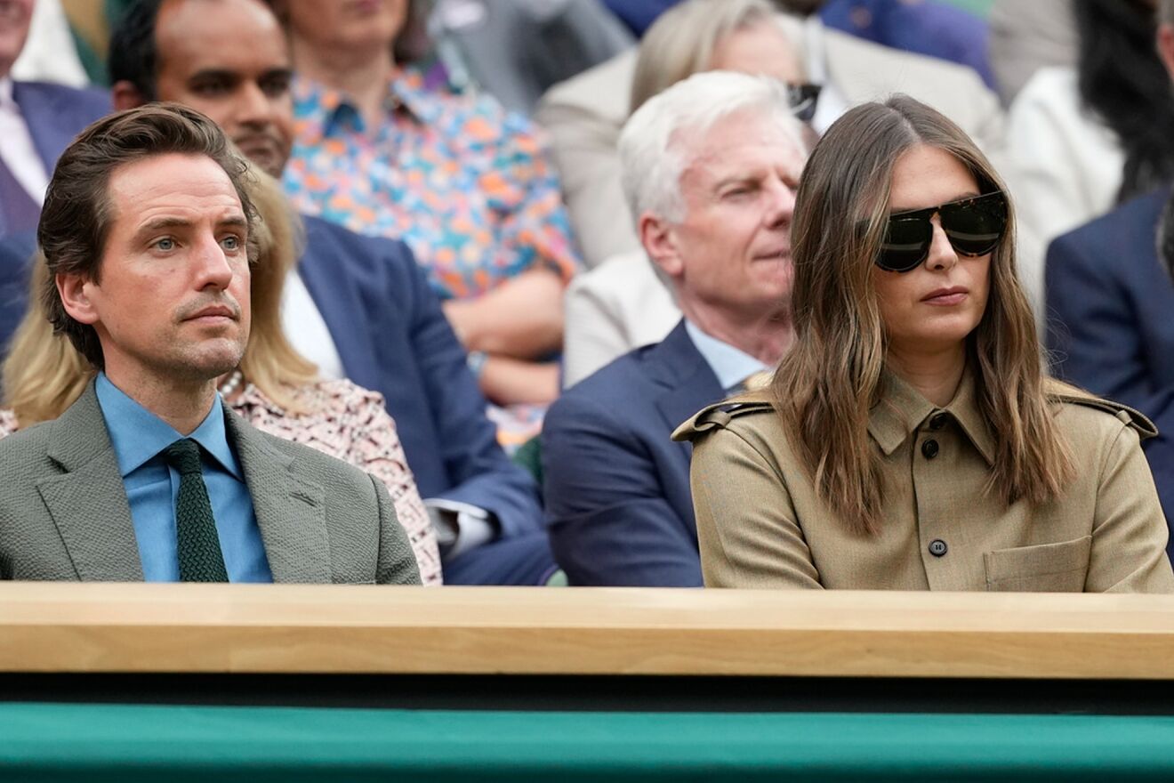 Maria Sharapova (R) and her fianc� Alexander Gilkes during a match at...