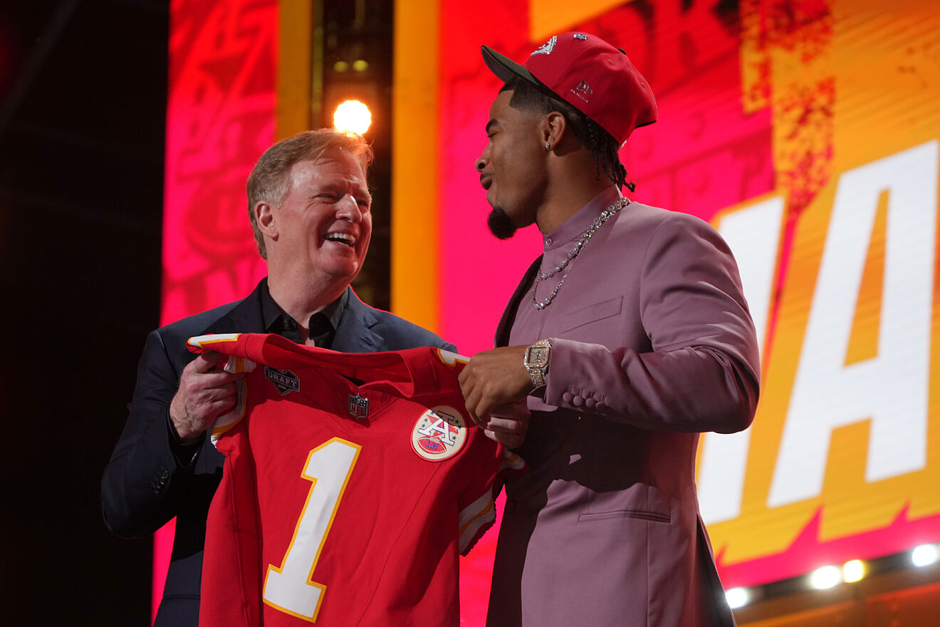 LSU defensive back Mansoor Delane, right, reacts with NFL Commissioner...