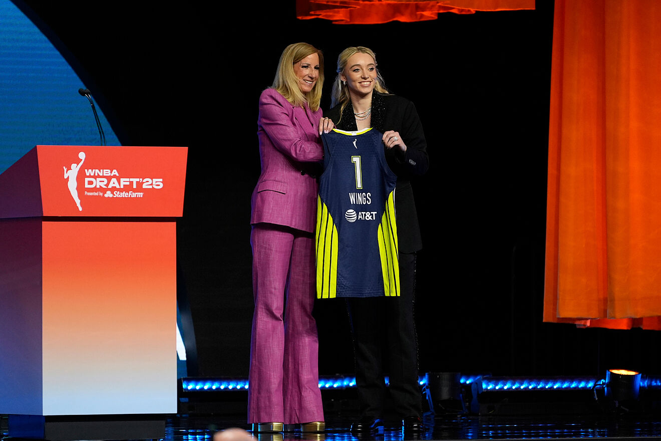 Paige Bueckers poses for a photo with WNBA commissioner Cathy...