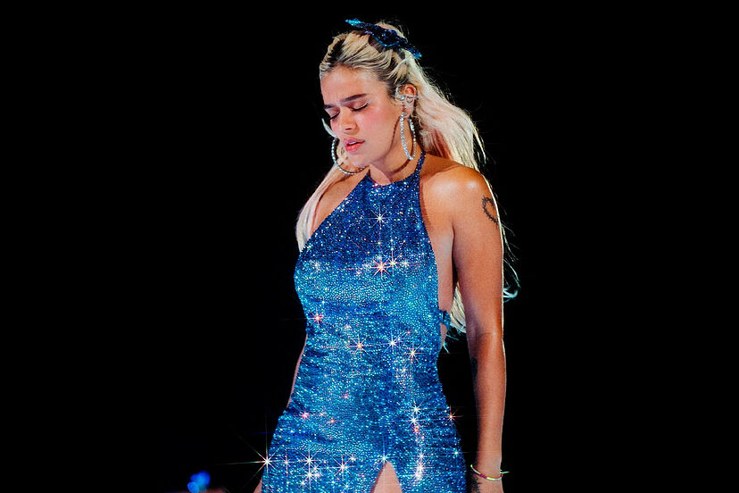 karol g blue dress Karol G reacts to being hit in the face by an object thrown during her  concert