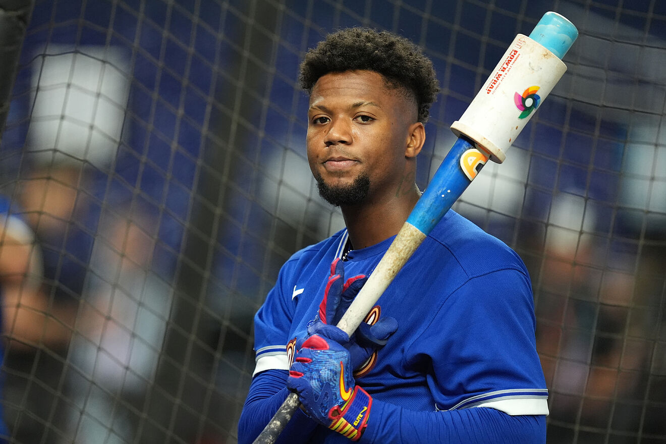 Ronald Acu�a Jr waits his turn at batting practice before a World...