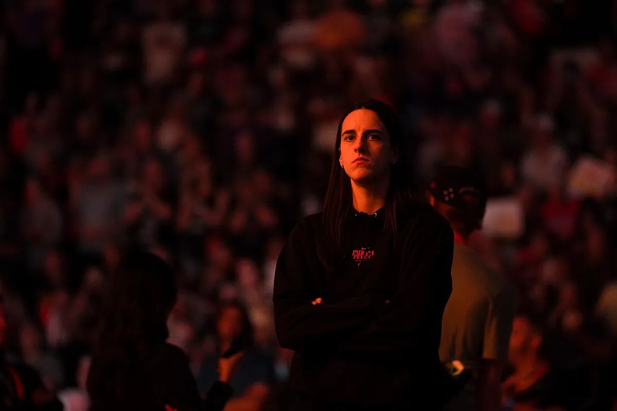 Caitlin Clark walks the runway for Prada with a touch of shyness, while Aliyah Boston can't hide her surprise